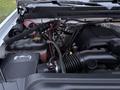 Engine compartment of a 2017 GMC Sierra 3500HD featuring a large engine block and various components including hoses and a battery