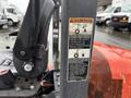 A 2012 Kubota F3680 tractor with a visible control panel and safety warning labels on the side