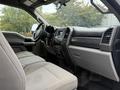 Interior view of a 2019 Ford F-350 SD showing the front seats dashboard and center console with Super Duty branding