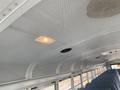 Interior view of a 2006 Thomas Saf-T-Liner HDX school bus showing the ceiling lights and overhead ventilation system