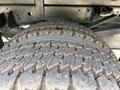 Close-up of a heavily treaded tire from a 2016 RAM 5500 showing deep grooves designed for traction and durability