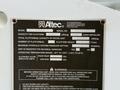 A metal label displaying specifications for an Altec LRV56 model including capacity details, serial number, platform height, and hydraulic system pressure indicators