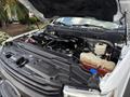 The image shows the open hood of a 2017 Ford F-550 with visible engine components including the engine block hoses and fluid reservoirs