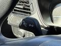 A control panel featuring various knobs and buttons for lights and turn signals in a 2020 Ford Escape interior