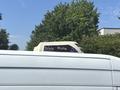 A 2019 Mercedes-Benz Sprinter with a rooftop air conditioning unit labeled Pluto