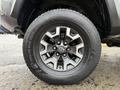 Close-up of a 2016 Toyota Tacoma wheel featuring a multi-spoke alloy rim and a Kumho tire with a rugged tread design