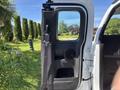 The open door of a 2011 Chevrolet Colorado showing the interior features including the speaker and handle