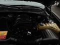 A 2017 Dodge Charger engine with visible components including the air intake and a coolant reservoir