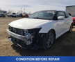 A white 2013 Scion TC with visible front damage including an exposed engine compartment and missing parts on the front bumper
