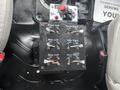 Control panel with multiple switches labeled for front left, side left, side right, rear right, and rear left functions in a 2006 Freightliner M2 106 vehicle