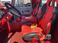 Interior of a 1962 Ford 2WHDR featuring red racing seats with harnesses and a black steering wheel