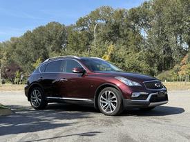 A 2017 Infiniti QX50 in a deep burgundy color with sleek lines and a polished finish parked at an angle showcasing its stylish rims and distinctive front grille