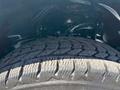 Close-up of the rugged tire tread of a 2019 Ford F-150 showcasing its design and deep grooves for traction