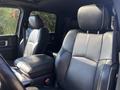 Interior of a 2018 RAM 3500 showing leather front seats with a center console and steering wheel visible in the foreground