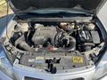 Engine compartment of a 2006 Pontiac G6 featuring a 3.5L V6 engine with various components including an air intake and battery