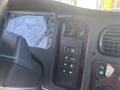 Dashboard of a 2022 Freightliner M2 106 featuring various gauges a trailer brake control and gear selector buttons