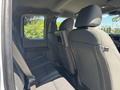 Interior view of the backseat of a 2019 Ford F-150 featuring two high-backed seats with seatbelts and a center armrest