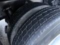 A close-up view of a worn tire on a 2004 Sterling LT9500 showcasing tread patterns and texture of the rubber surface