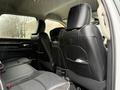 Interior view of a 2024 RAM 5500 featuring black leather seats with stitching and headrests visible from the rear passenger area