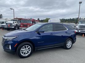 A blue 2022 Chevrolet Equinox parked with a sleek design and alloy wheels visible on the side