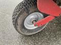 Close-up of a 2017 Ferris Rotary lawn mower wheel featuring a treaded tire and metal rim with visible wear marks