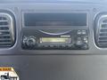 Dashboard of a 2014 Freightliner M2 106 featuring a radio with controls and a digital display
