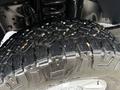 Close-up of a rugged tire tread on a 2019 Ford F-350 SD showcasing deep grooves and detailed design ideal for off-road traction