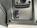 Close-up of a switch panel in a 2021 Freightliner M2 106 featuring a black toggle switch with a circular symbol