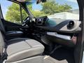 Interior view of a 2019 Mercedes-Benz Sprinter showing driver and passenger seats dashboard and controls
