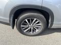 Close-up of a gray 2018 Toyota Highlander wheel with a silver alloy rim and all-season tire
