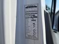 2019 Ford Transit 350 van with a service performed label detailing mileage and maintenance checks including oil filter and brake fluid