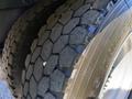 Close-up of a tire from a 2019 Peterbilt 337 showing detailed tread pattern and sidewall markings