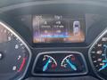 Dashboard display of a 2015 Ford Escape showing temperature 25°C trip details including distance 244 km fuel efficiency 10.6 L/100 km and odometer reading 086245 km