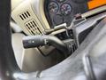 Close-up of the turn signal lever on a 2011 International 4300 truck's steering column showing various settings and indicators