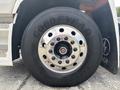 A close-up view of a 2020 Lion Lion6 truck tire featuring a shiny chrome wheel rim and a Goodyear tire with deep tread patterns
