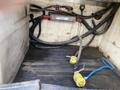A 2015 Ford F-550 with visible electrical connections and wiring in the cargo area