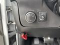 Dashboard controls of a 2018 Chevrolet Express including headlight settings and a switch for dome lights