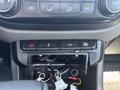 Dashboard of a 2017 Chevrolet Colorado featuring control buttons and an open compartment revealing wires and connectors