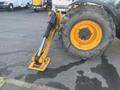 A 2013 JCB 510-56 Loadall with a large yellow wheel and hydraulic arm extended down towards the ground
