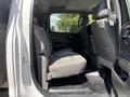 Interior view of the back seat of a 2020 Chevrolet Silverado featuring cloth seats and a spacious layout