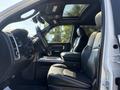 Interior of a 2018 RAM 3500 showing the front seats and dashboard with a sunroof and steering wheel visible