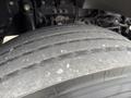 Close-up of a worn tire from a 2019 Ford F-750 showing significant tread wear and a smooth surface without visible grooves