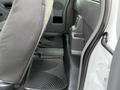 Interior view of a 2011 Ford Ranger showing the rear floor area with rubber floor mats and the back of the front seat
