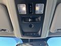 Interior overhead console of a 2015 RAM 1500 featuring dome lights vent controls and switch buttons