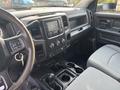 Interior view of a 2013 RAM 5500 showing the dashboard steering wheel and front seating area with controls and storage compartments