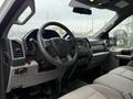 The interior of a 2019 Ford F-350 SD featuring a steering wheel dashboard and front seats with cloth upholstery