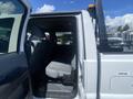 A 2016 Ford F-350 SD with a gray interior featuring a rear bench seat and spacious cabin area