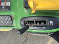 Top view of the gear shifter on a 2021 John Deere L Series S with a black handle and multiple gear options displayed