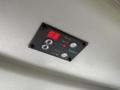 Control panel featuring a digital display set to 66 with buttons labeled for heat, fan, and cooling functions