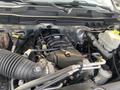Engine of a 2016 RAM 5500 with visible components including air intake hose battery and various hoses and pipes